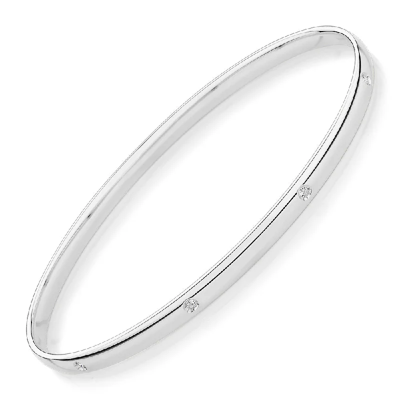 Oval bangle with diamond simulants in 10 carat white gold