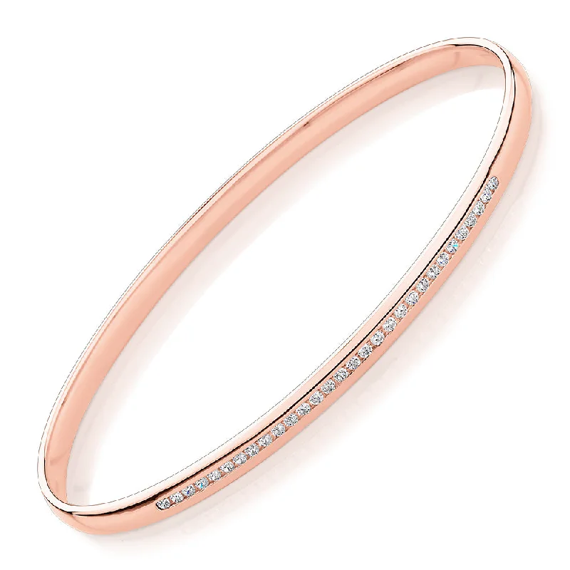 Oval bangle with 0.45 carats* of diamond simulants in 10 carat rose gold